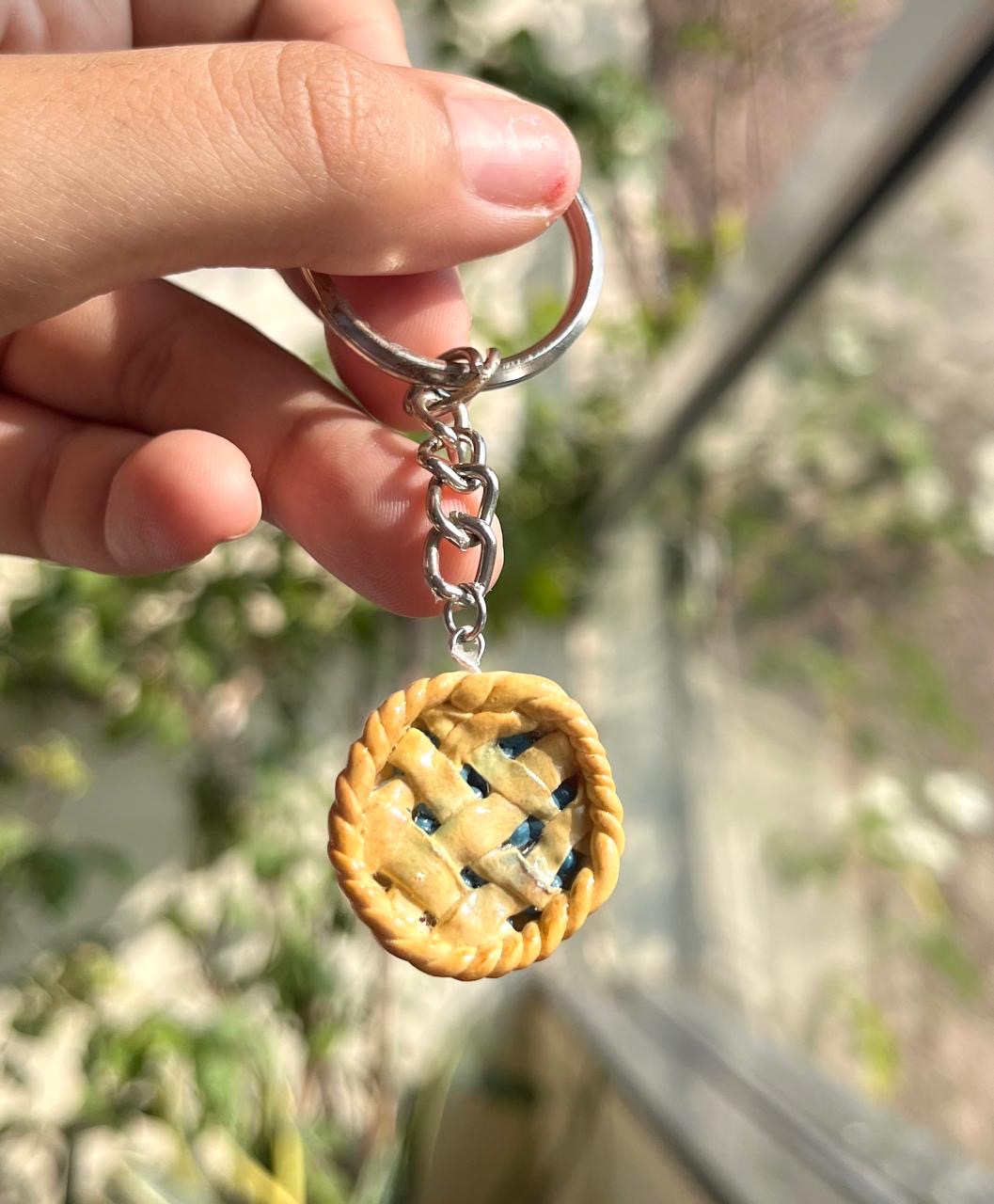 Miniature handmade berry pie keychain