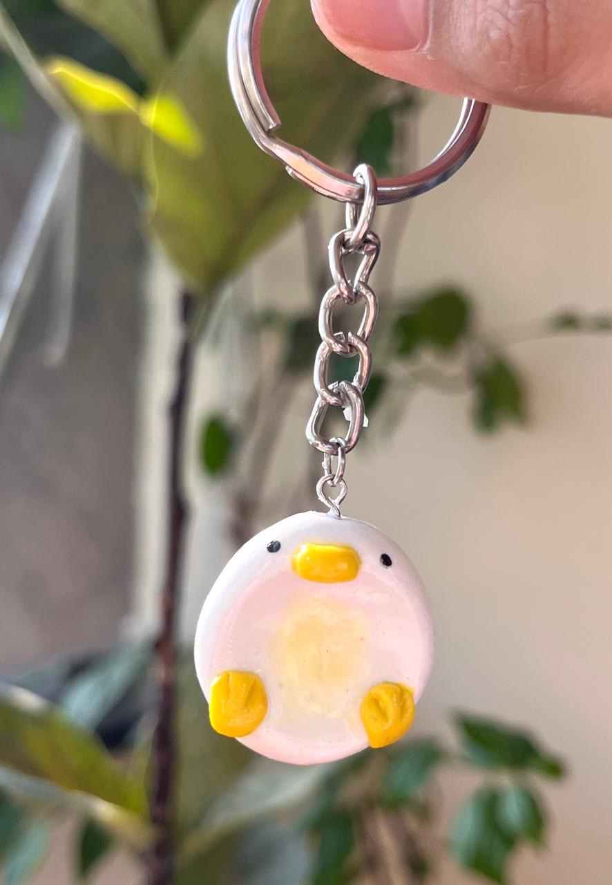 Handmade white chick charm with yellow beak and feet